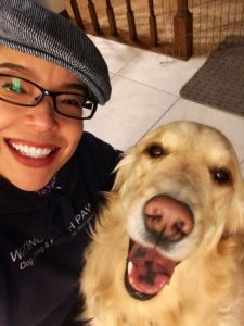 Nicole Narita taking a selfie with graduate student and certified Therapy Dog Miss Shiloh.